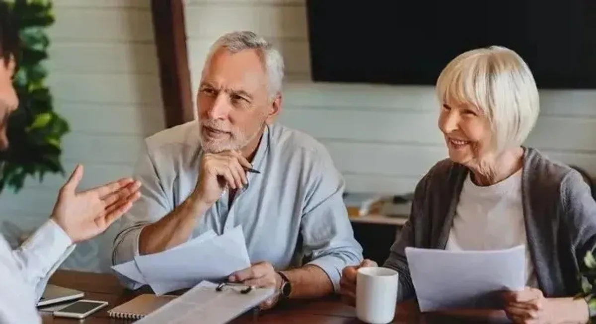 Financial advisor meeting with a retired couple