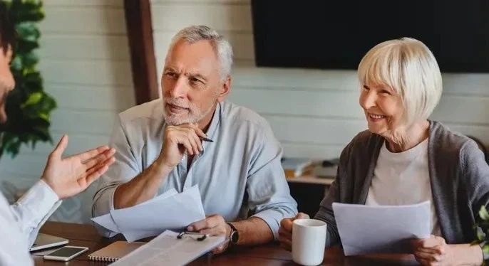 Financial advisor meeting with a retired couple