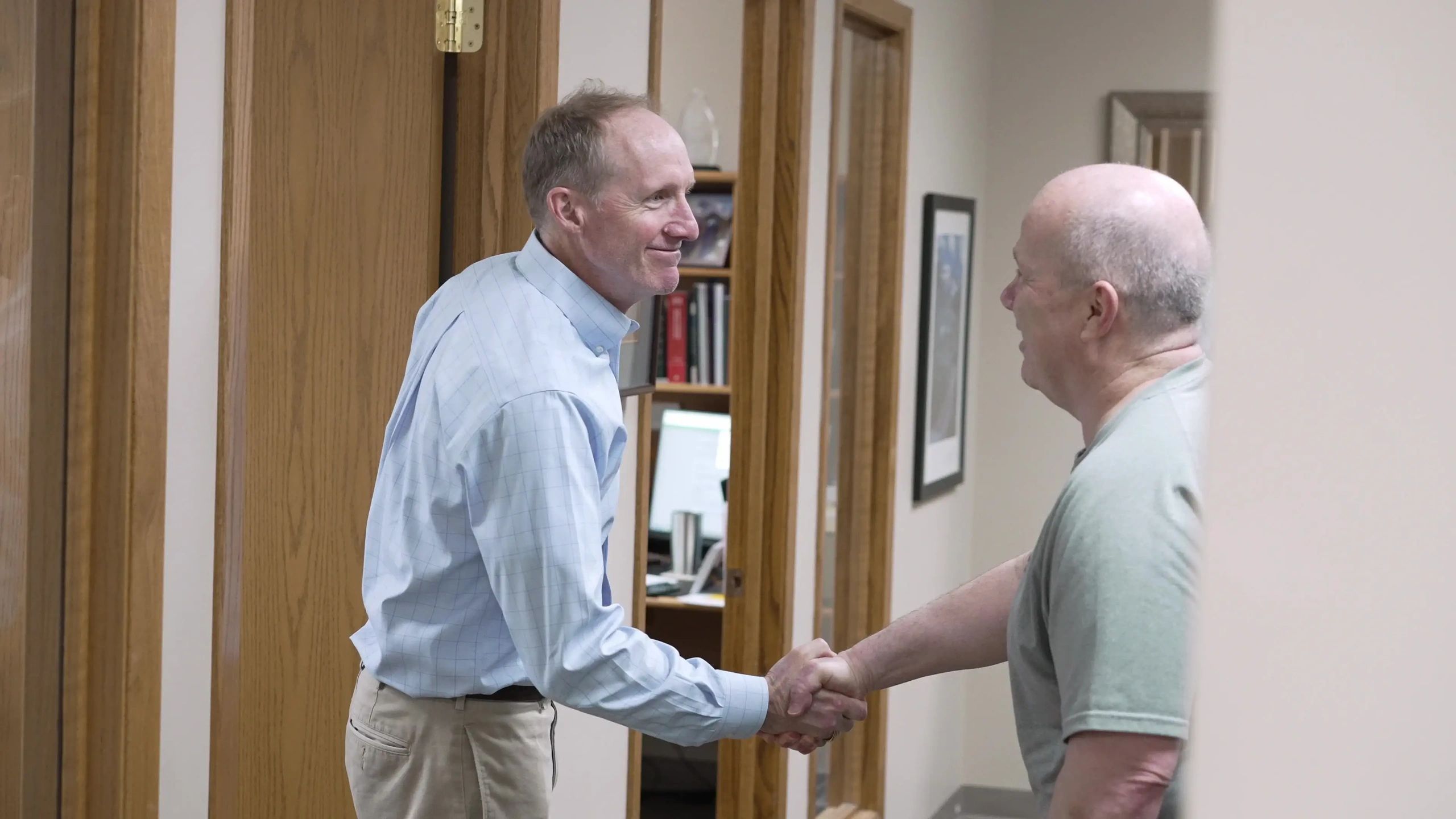Financial advisor shaking hands with a new client