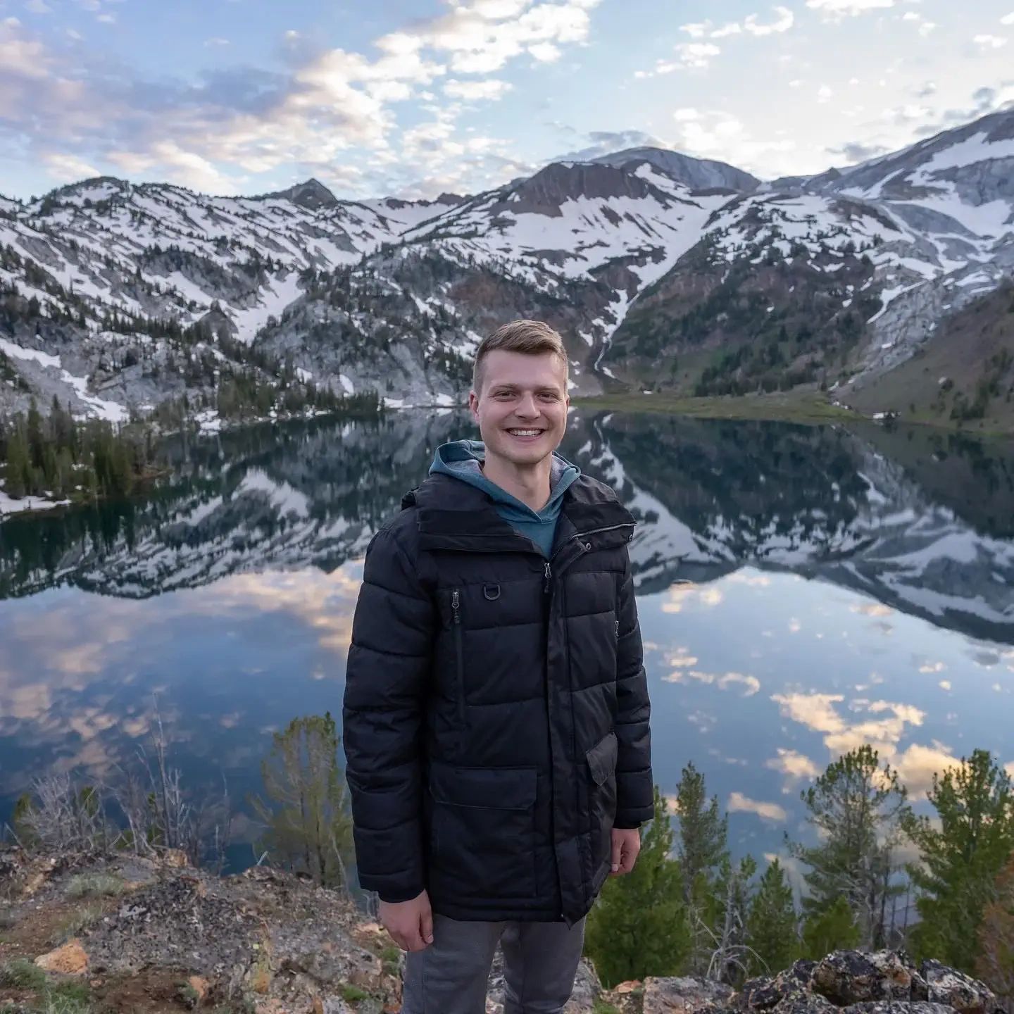 Noah hiking above an alpine lake in Washington